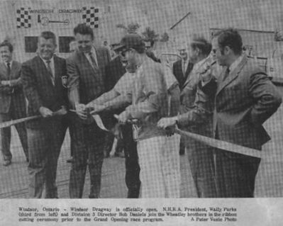 Windsor Dragway is officially open August 25, 1968 
Windsor, Ontario - Windsor Dragway is officially open. N.H.R.A. President, Wally Parks (third from left) and Division 3 Director Bob Daniels join the Wheatley brothers in the ribbon cutting ceremony prior to the Grand Opening race program.   

Photo Credit: Bill Arps
Keywords: Windsor Dragway is officially open August 25, 1968